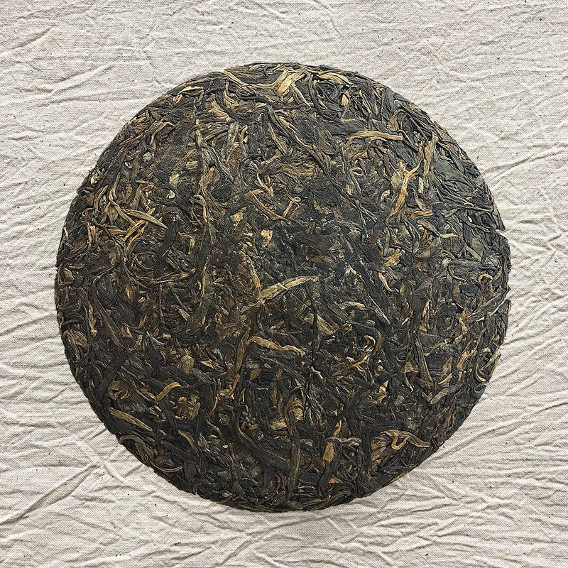 Mansa Tea | Amber Pu'er | Bangwei Ancient Tree Raw Pu'er | high quality aged pu'er or pu-erh tea, a type of post-fermented tea from Yunnan province, with aging potential of 40-60 years - image of aged pu'er or pu-erhtea cake
