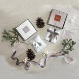 Mansa Tea | Single Origin Aged Tea for Modern Connoisseurs | Photo of packaging of curated set of aged teas, including Depths of Aged Pu'er