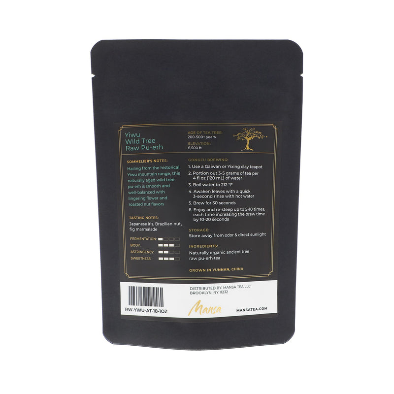 Backside packaging of Yiwu Wild Tree Raw Pu-erh. A black pouch with a label with sommelier's notes and tasting notes.