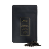 Boseong Korean Black front packaging photo. A black pouch with a label with a piece of broken tea cake