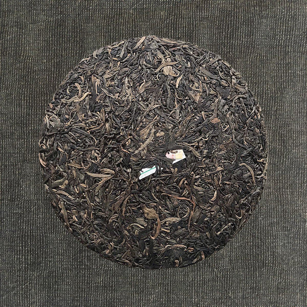 Mansa Tea | Amber Pu'er | Banzhang Raw Pu'er | high quality aged pu'er or pu-erh tea, a type of post-fermented tea from Yunnan province, with aging potential of 40-60 years - image of aged pu'er, aged pu-erh tea cake